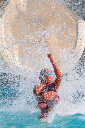 jump out of the water slide in the poolの写真素材