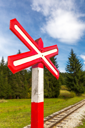 Sign of railroad crossing of a single-track forest railway.の写真素材