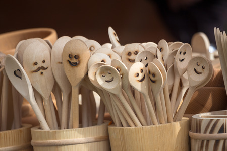 Decorated wooden spoons on the market.の写真素材