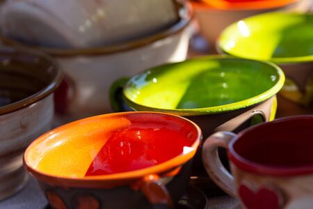Multicolored ceramic bowls. Used low depth of field with blurred background.の写真素材