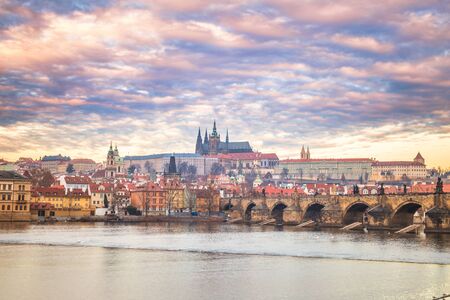 Prague Castle and Charles bridge above Vltava river early morning with beautiful sky, Czech...