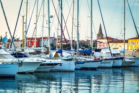 Harbor with docked boats in Porec town on Adriatic sea in Croatia, Europe.