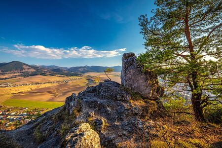 Spring landscape with valley and mountains in background. View from The Sunny Rocks in The Rajec Valley, Slovakia, Europe.の写真素材