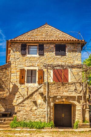 Stone facade of ancient house. The Groznjan village on Istria in Croatia, Europe.の写真素材