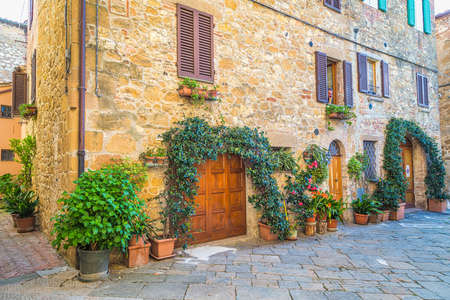 Street with an old house in Pienza, a town in the province of Siena, in the Val d'Orcia in Tuscany, Italy, Europe.のeditorial素材
