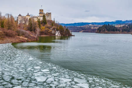 Niedzica Castle at Lake Czorsztyn at the end of winter, Poland, Europe.
