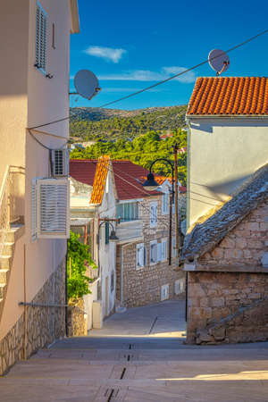 Street of Primosten town, a popular tourist destination on the Dalmatian coast of Adriatic sea in...