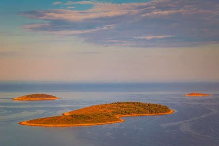 Panoramic view of Adriatic coast near The Primosten town at the colorful dawn of the day, Croatia, Europe.の写真素材