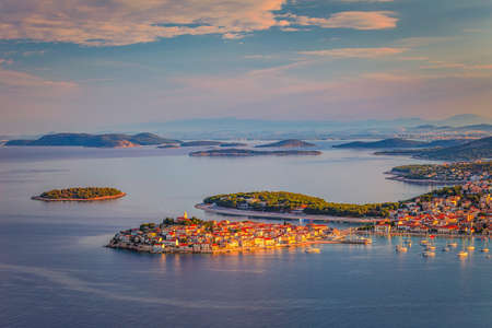 Panoramic view of Adriatic coast with The Primosten town at the colorful dawn of the day, Croatia, Europe.の写真素材