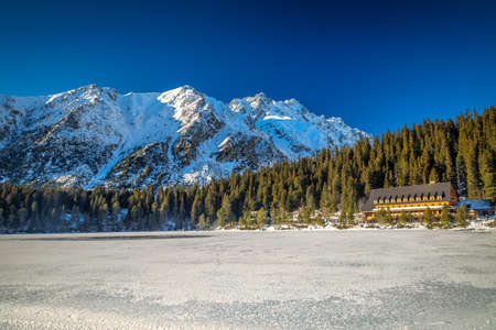 Mountain landscape with frozen tarn at winter season. The Popradske pleso lake in High Tatras National Park, Slovakia, Europe.の写真素材