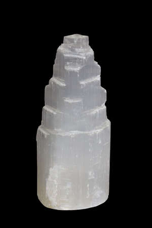 Selenite, a mineral stone on black background.の写真素材