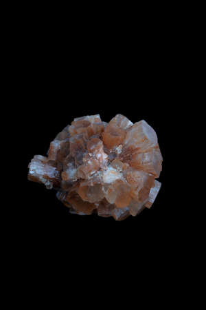 Aragonite crystal cluster, a mineral stone on black background.の写真素材