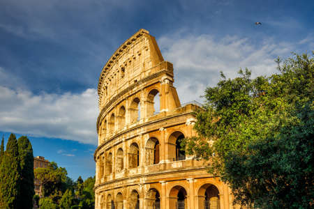 The Colosseum amphitheater in the center of the city of Rome at sunset, Italy, Europe.の写真素材
