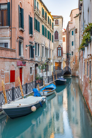 The canal with a boat in Venice, Italy, Europe.の写真素材