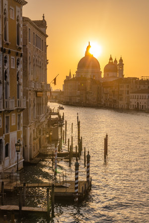 The Grand Canal in Venice with the Santa Maria della Salute basilica at a beautiful sunrise, Italy, Europe.の写真素材