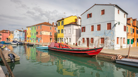 The Burano island near Venice, a canal with colorful houses, Italy, Europe.の写真素材