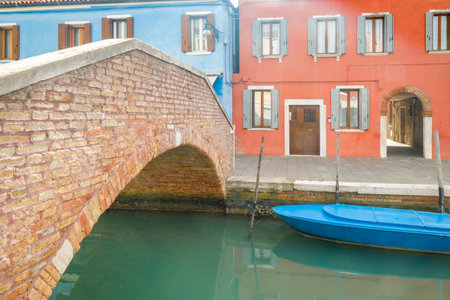 Stone bridge over the canal in Burano island near Venice, Italy, Europe.の写真素材