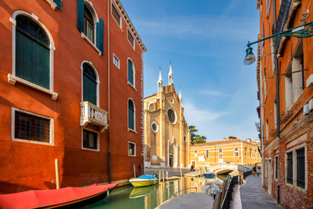 Canal with The Basilica di Santa Maria Gloriosa dei Frari, church in Venice, Italy, Europe.の写真素材