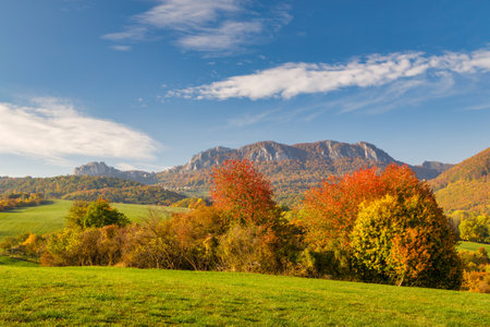 View of autumn landscape with rocky mountains in the background. The Vrsatec National Nature Reserve in the White Carpathian Mountains, Slovakia, Europe.の写真素材