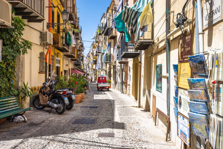 CEFALU, ITALY - JULY 16, 2023: Street at center of town, an attractive destination in Sicily.のeditorial素材