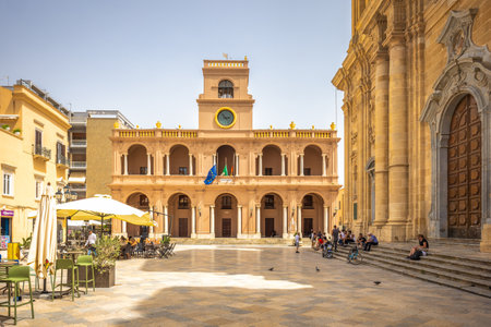MARSALA, ITALY - JULY 8, 2023: Palace VII April with Cathedral in historic center.のeditorial素材