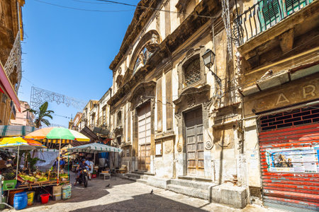 PALERMO, ITALY - JULY 18, 2023: Historic houses at street market.のeditorial素材