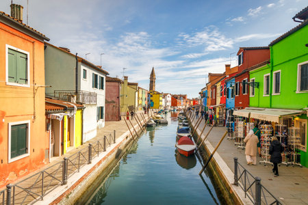 BURANO, ITALY - MARCH 3, 2023: The island near Venice with a canals between colorful houses.のeditorial素材