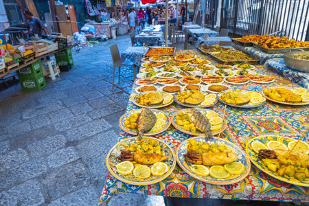 PALERMO, ITALY - JULY 18, 2023: Street market with fish dishes.のeditorial素材