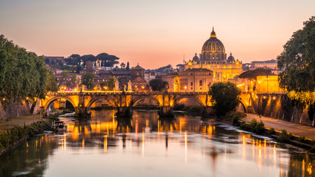 ROME, ITALY - MAY 10, 2022: Ponte Sant'Angelo with St. Peter's Basilica at sunset.のeditorial素材