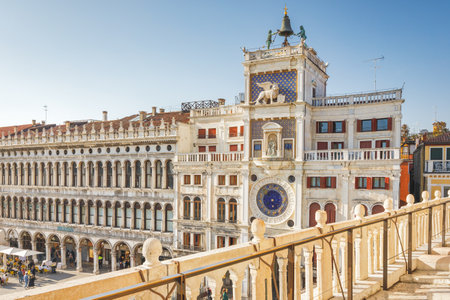 VENICE, ITALY - MARCH 4, 2023: St Mark's clock tower, view from the terrace of St. Mark's Basilica.のeditorial素材