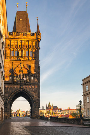 Old Town Bridge Tower at the beginning of the Charles Bridge and with Prague caste on the background, Prague, Czech Republic, Europe.の写真素材