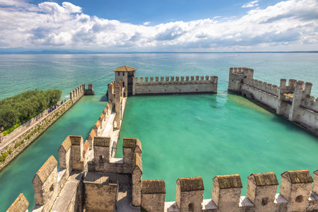 The walls of the Scaligero Castle on Lake Garda in the historical center of Sirmione, Italy, Europe.の写真素材