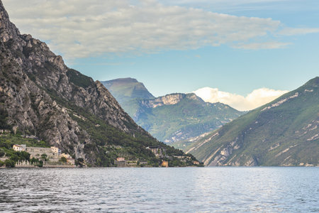 Lake Garda with mountains in the background, view from Limone Sul Garda town, Italy.の写真素材