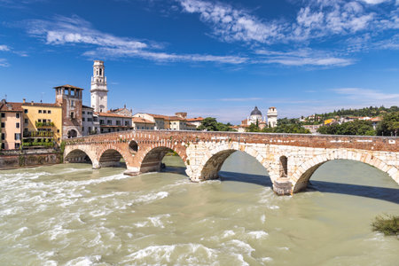 The Ponte Pietra roman arch bridge crossing the Adige River in Verona town, Italy, Europe.の写真素材