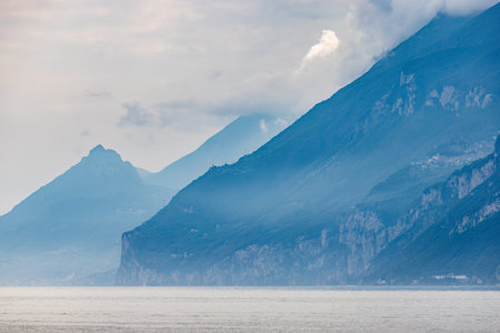 Lake Garda with mountains, view from Malcesine town on the eastern shore of the lake, Italy, Europe.の写真素材