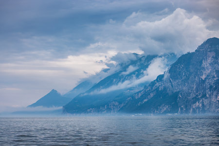 Lake Garda with mountains in the background, view from Malcesine town on the eastern shore of the lake, Italy, Europe.の写真素材