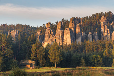 Adrspach-Teplice Rocks, sandstone formations in Hradec Kralove Region in Czech Republic, Europe. Scenic view of towering rock formations surrounded by lush greenery, creating a natural landscapeの写真素材