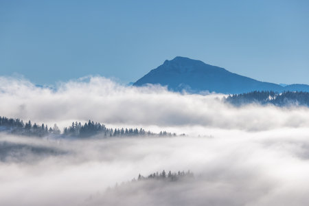 Foggy winter landscape in a sunny morning. The Orava region in north of Slovakia, Europe.の写真素材