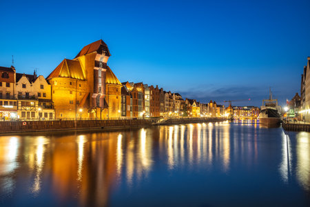 Gdansk with medieval port crane over The Motlawa river, a city on the Baltic coast of northern...