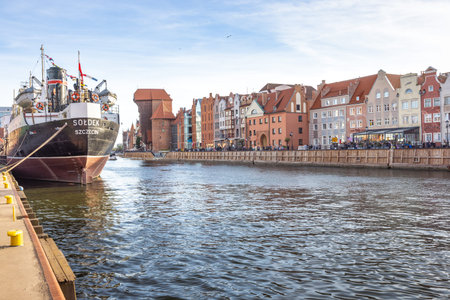 Gdansk, Poland - May 1, 2025: Historic center of town with the Motlawa River. Riverside Scene:...