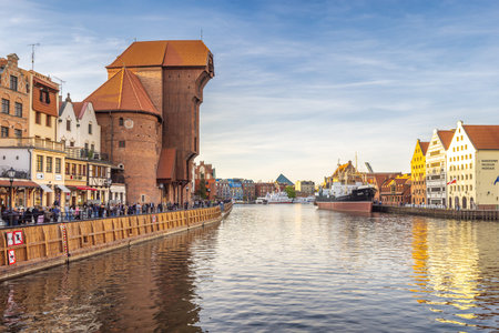 Gdansk, Poland - May 1, 2025: Historic centre of town with medieval port crane over the Motlawa...