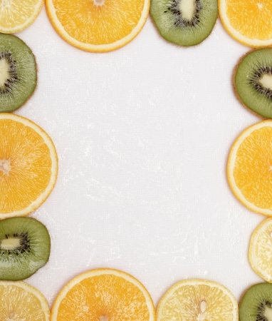 sliced fruit on the white trayの写真素材