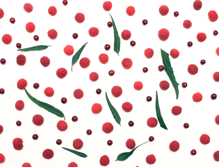 composition of red berries scattered on the tableの写真素材