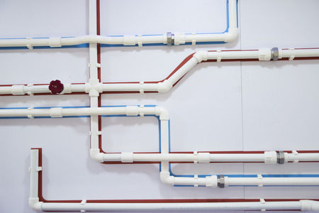 scheme of the pipeline with blue and red plastic tubes for cold and hot water