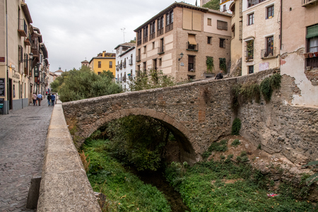 Old stone bridge in historical part of Granada, Spain.のeditorial素材