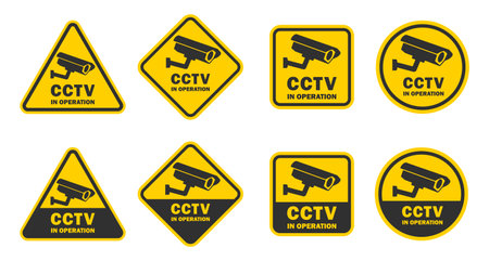CCTV in operation yellow black sign set. Security cameras in use symbol icon. CCTV camera logo sign collection. Vector illustration image. Isolated on white background.のイラスト素材
