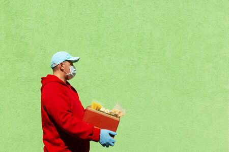 man with a box of food, help and donation of food