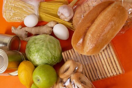 the food on an orange background view from aboveの写真素材