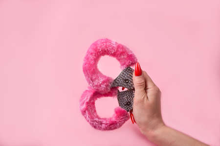 on a pink background sex product, a toy for adultsの写真素材
