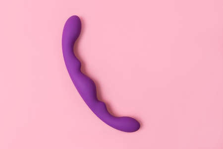 on a pink background sex product, a toy for adultsの写真素材